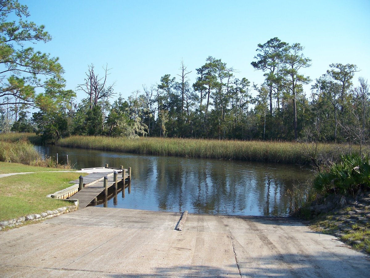 The boat ramp and dock on a marsh-lined channel at Ochlockonee River State Park
